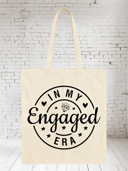 Beige canvas tote bag with 'In My Engaged Era' text